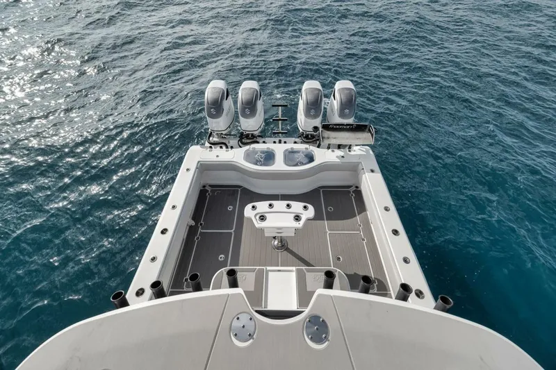 Slide: The Image of Freeman 42LR 2019 boat with triple engines on open water. - 40