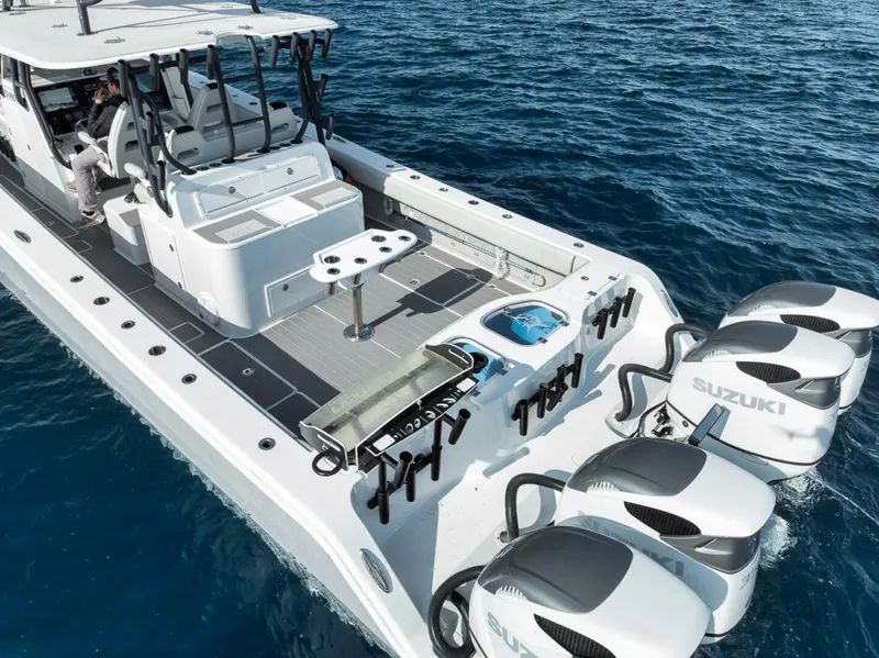 Slide: The Image of Freeman 42LR 2019 boat with Suzuki engines on open water. - 43