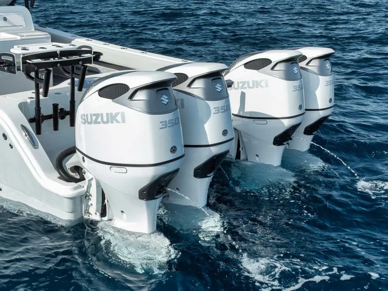 Slide: The Image of Four Suzuki 350 outboard motors on a 2019 Freeman 42LR boat in the ocean. - 44