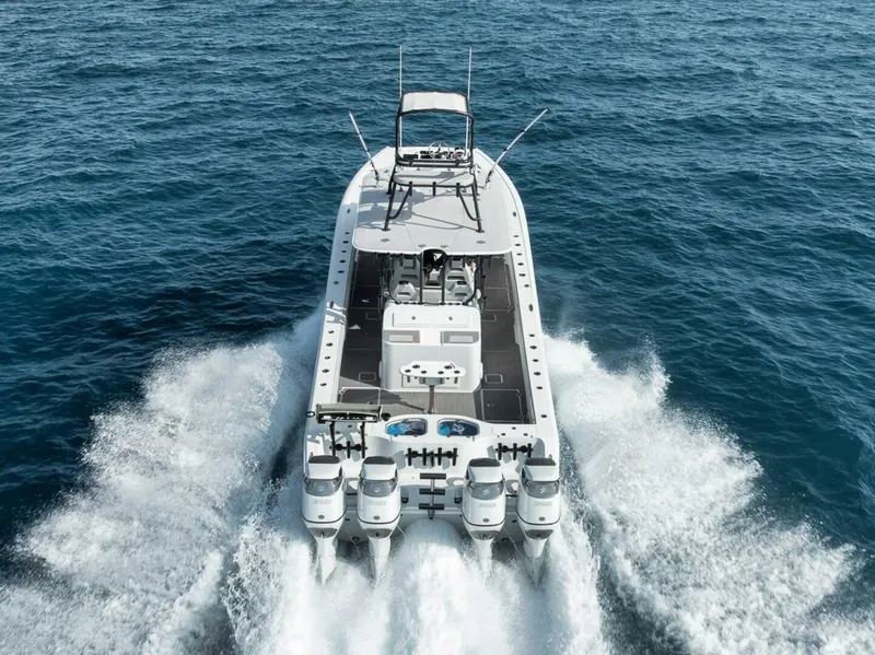 Slide: The Image of 2019 Freeman 42LR boat cruising on open water, rear view. - 5