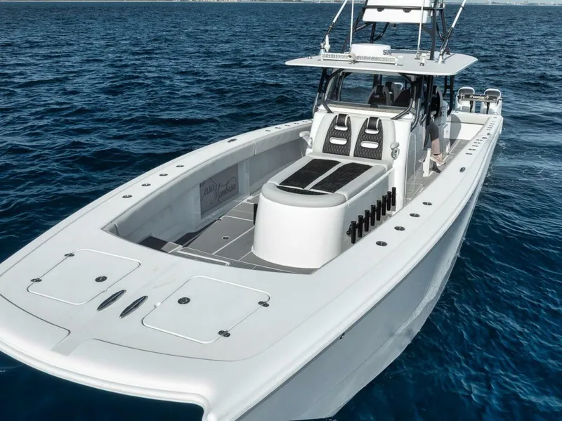 Slide: The Image of 2019 Freeman 42LR boat on open water, showcasing sleek design and spacious deck. - 8