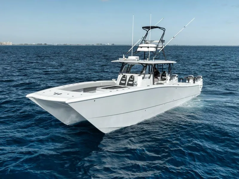 Slide: The Image of 2019 Freeman 42LR boat cruising on open ocean waters. - 9
