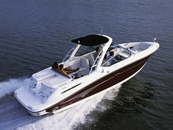 Slide: The Image of 2005 Sea Ray 270 Select EX boat cruising on open water with passengers onboard. - 27