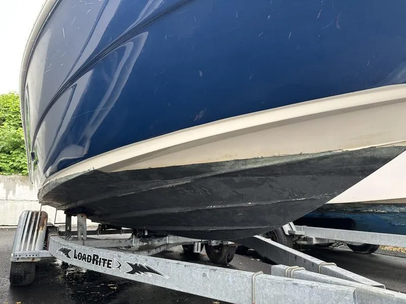 Slide: The Image of 2006 Sea Ray 220 Sundeck boat on LoadRite trailer, close-up view. - 4
