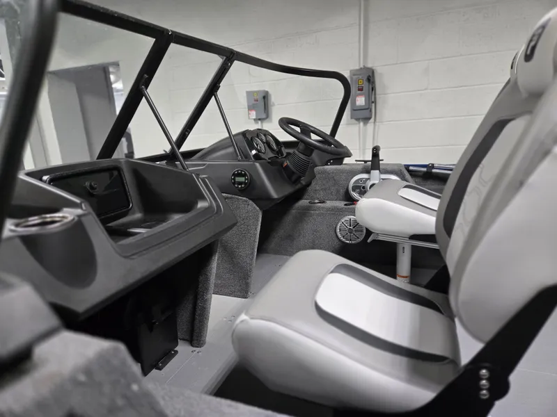 Slide: The Image of 2025 Princecraft Holiday 162 WS MAX boat interior with modern seating and dashboard. - 4