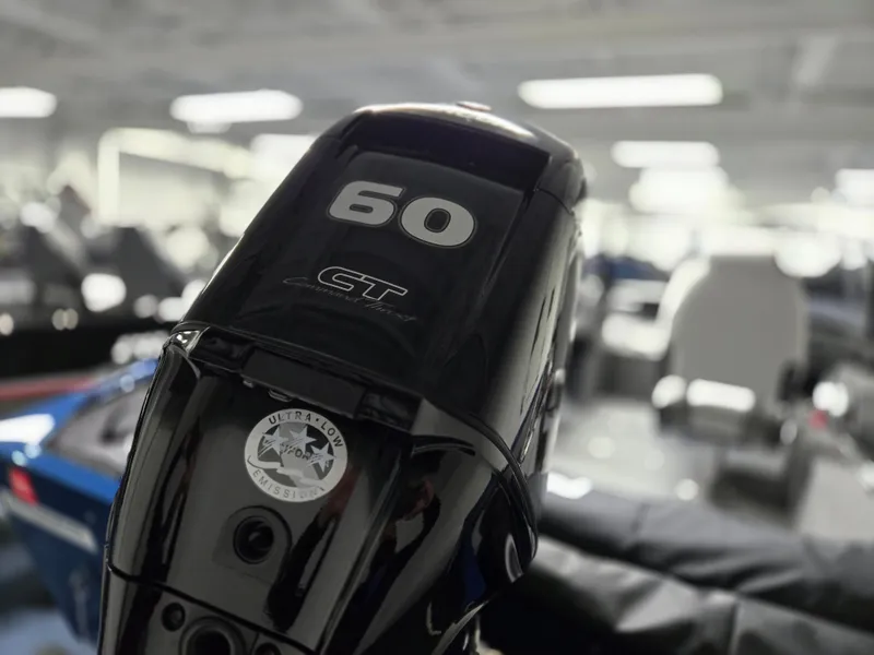 Slide: The Image of Outboard motor on a 2025 Princecraft Holiday 162 WS MAX boat, featuring 60 CT branding. - 8