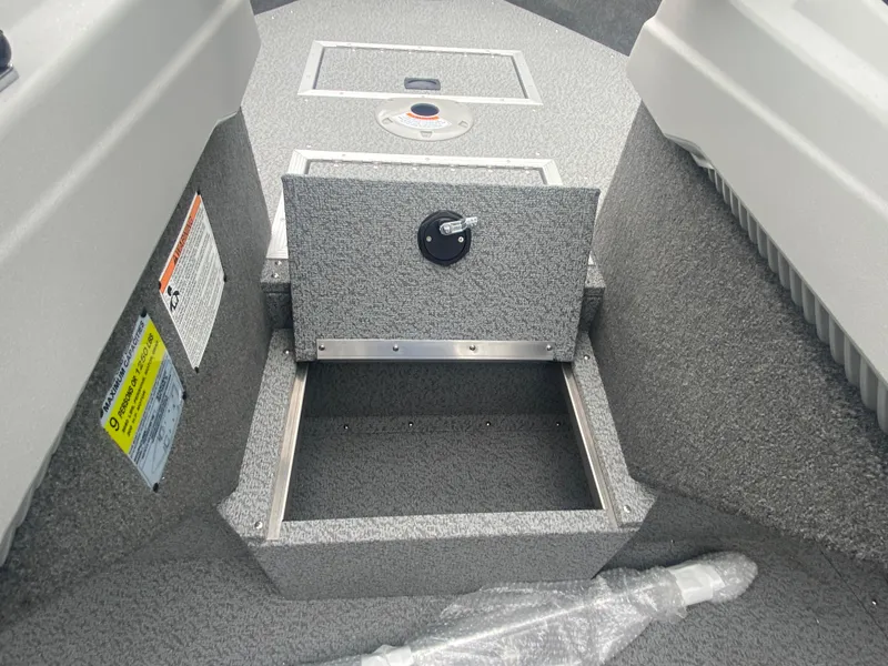 Slide: The Image of Starcraft Fishmaster 196 boat storage compartment, 2025 model, open with visible interior. - 3