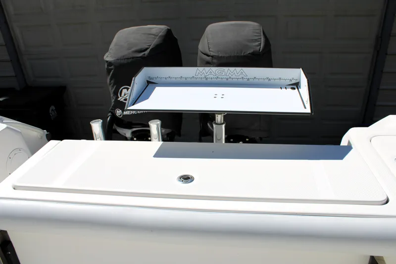 Slide: The Image of 2008 Edgewater 318CC boat with Magma cutting board and covered seats. - 14