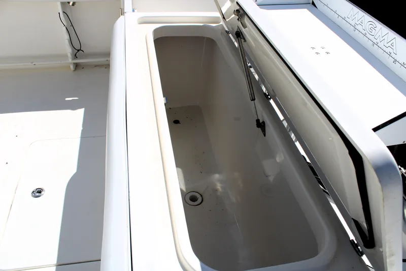 Slide: The Image of Open storage compartment on 2008 Edgewater 318CC boat, showcasing spacious interior. - 15