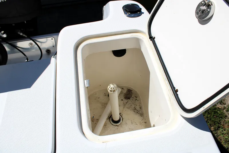 Slide: The Image of Open storage compartment on a 2008 Edgewater 318CC boat. - 16