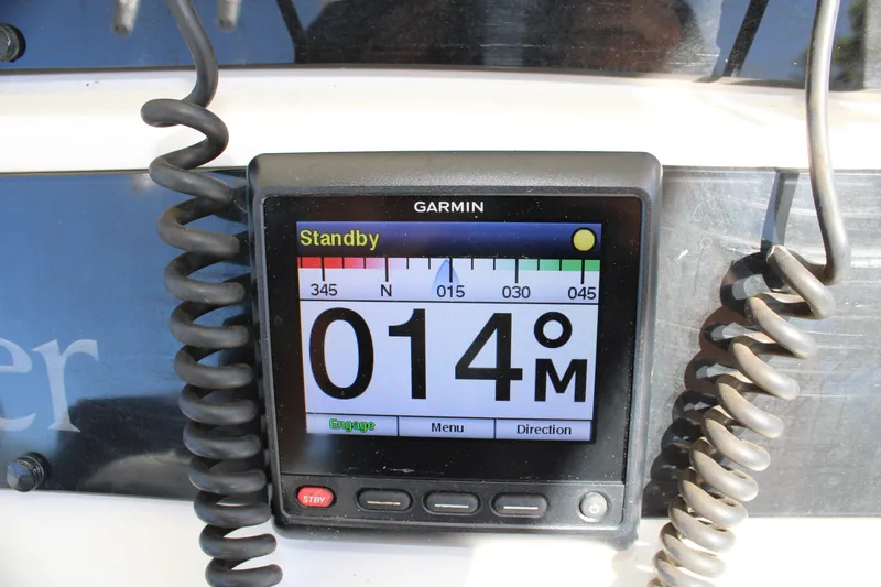 Slide: The Image of Garmin marine navigation display on 2008 Edgewater 318CC boat, showing compass heading. - 26