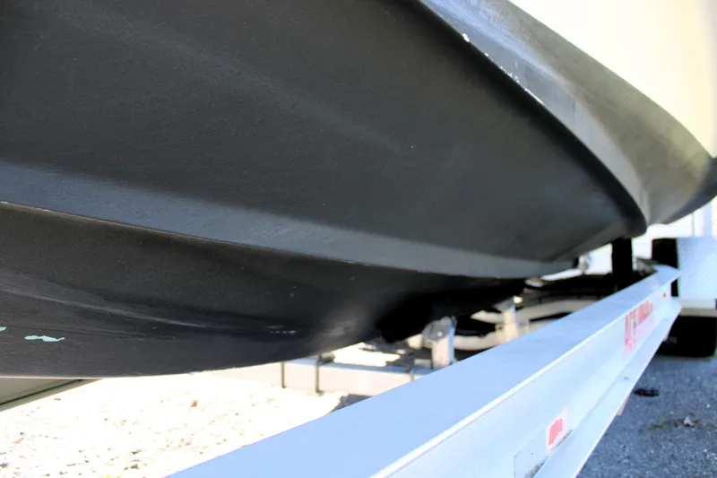 Slide: The Image of 2008 Edgewater 318CC boat hull on trailer, close-up view. - 3