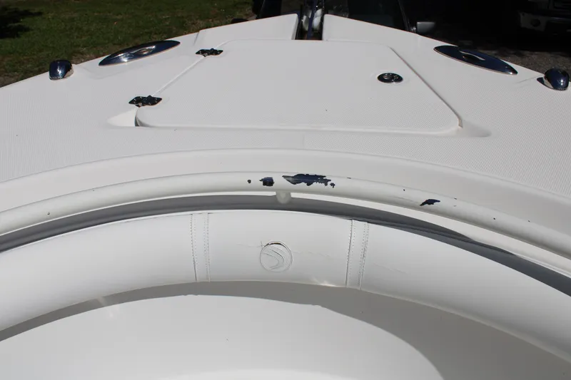 Slide: The Image of 2008 Edgewater 318CC boat with minor paint chipping on the deck. - 31