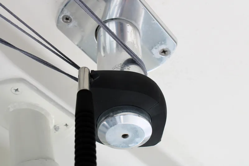 Slide: The Image of Close-up of a 2008 Edgewater 318CC boat component with cables and metal fixture. - 49