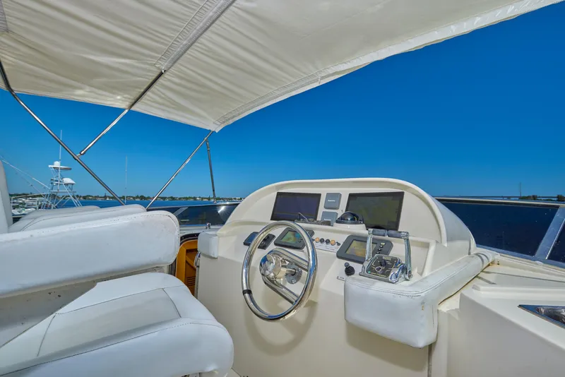 Slide: The Image of Pilothouse of 2003 McKinna 58 yacht with steering wheel and navigation equipment. - 10