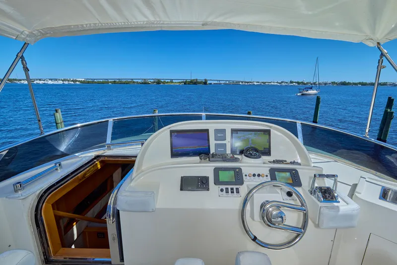 Slide: The Image of 2003 McKinna 58 Pilothouse helm with ocean view and navigation equipment. - 11