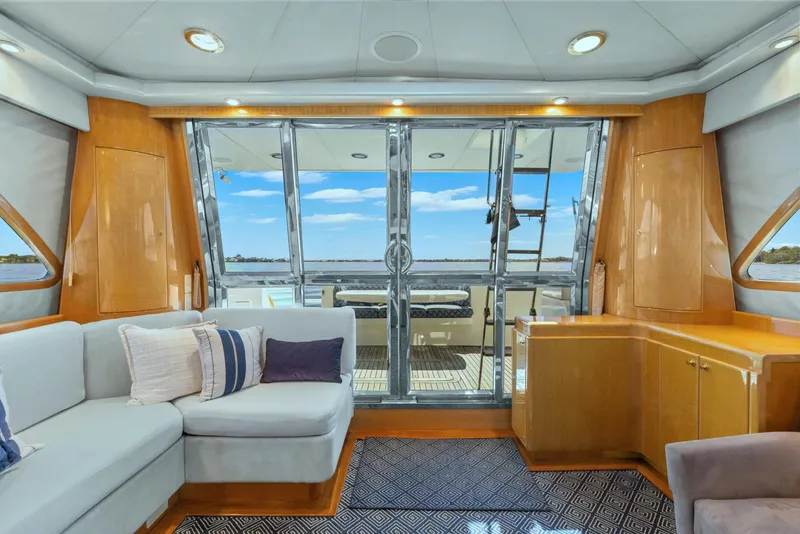 Slide: The Image of Luxurious interior of 2003 McKinna 58 Pilothouse yacht with plush seating and ocean view. - 22