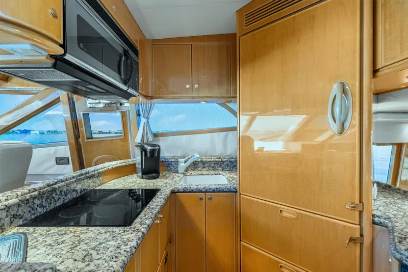Slide: The Image of Luxurious kitchen interior of 2003 McKinna 58 Pilothouse yacht with granite countertops. - 24