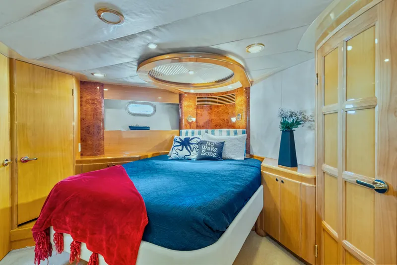 Slide: The Image of Luxurious cabin interior of 2003 McKinna 58 Pilothouse yacht with elegant wood finishes. - 32
