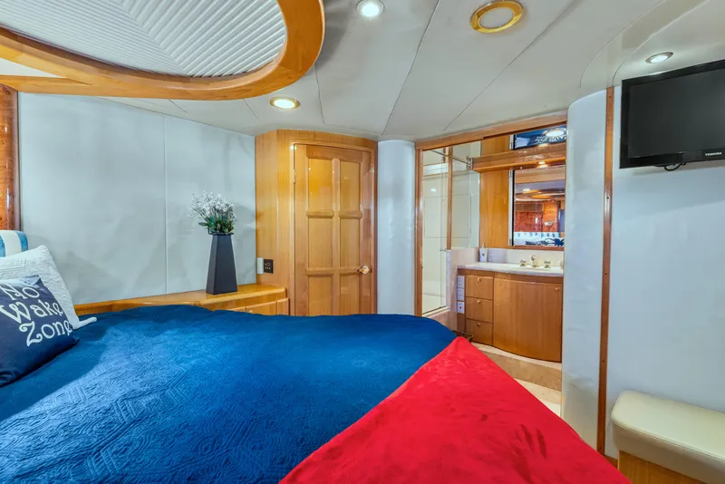 Slide: The Image of Luxurious cabin interior of 2003 McKinna 58 Pilothouse yacht with cozy bedding and ensuite bathroom. - 34