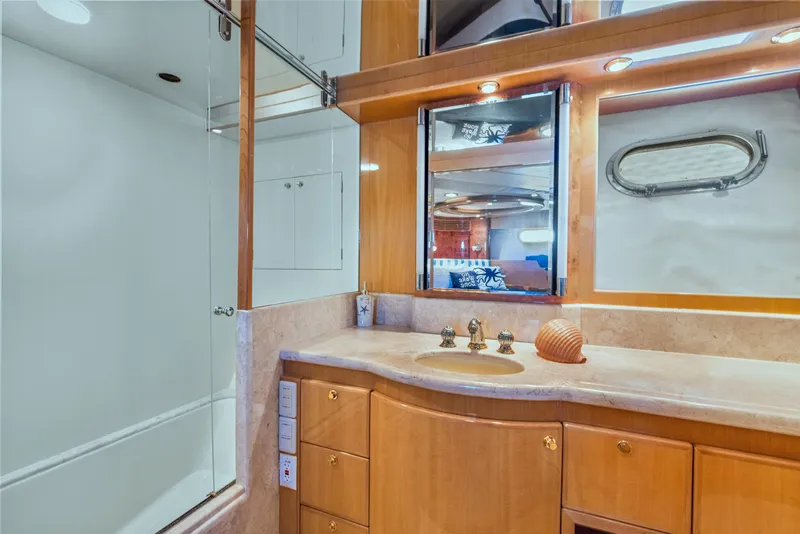 Slide: The Image of Luxurious bathroom in 2003 McKinna 58 Pilothouse yacht with elegant wood cabinetry. - 35