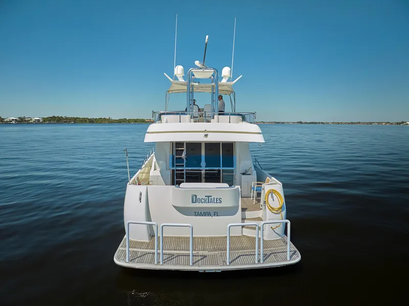 Slide: The Image of 2003 McKinna 58 Pilothouse yacht on calm water, rear view. - 45