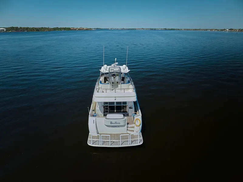 Slide: The Image of 2003 McKinna 58 Pilothouse yacht on calm water, rear view. - 46