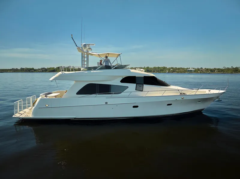 Slide: The Image of 2003 McKinna 58 Pilothouse yacht cruising on calm waters. - 49