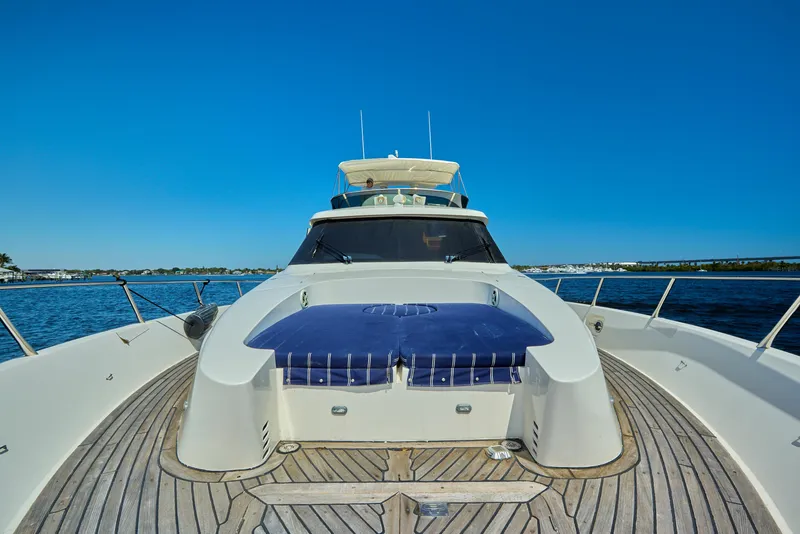 Slide: The Image of 2003 McKinna 58 Pilothouse yacht on open water, showcasing sleek design and spacious deck. - 7