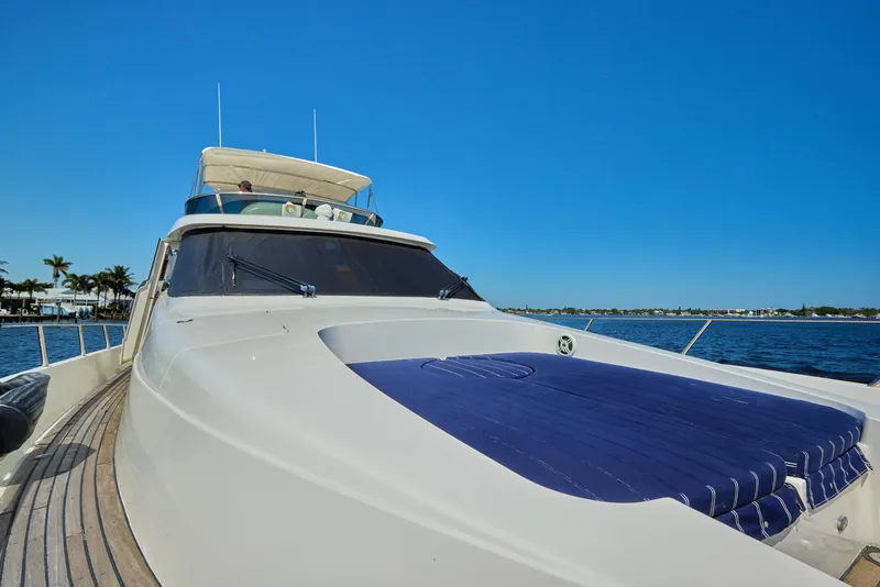 Slide: The Image of 2003 McKinna 58 Pilothouse yacht on calm water under clear blue sky. - 9