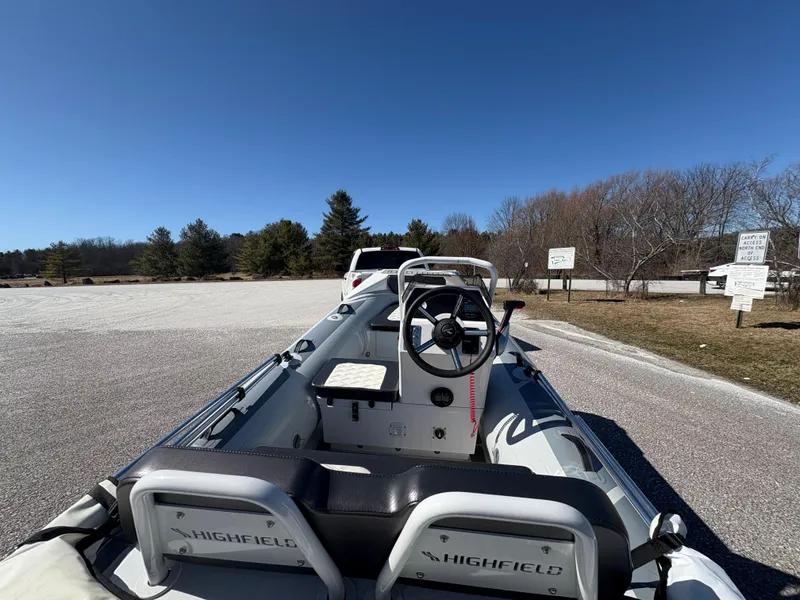 Slide: The Image of 2023 Highfield Sport 360 boat parked on a sunny day in a scenic area. - 11