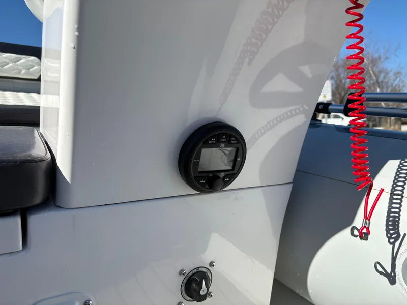 Slide: The Image of 2023 Highfield Sport 360 boat dashboard with control panel and safety cord. - 20