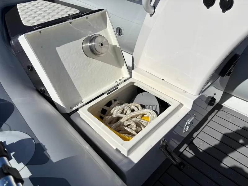 Slide: The Image of Open storage compartment on 2023 Highfield Sport 360 boat with rope inside. - 23