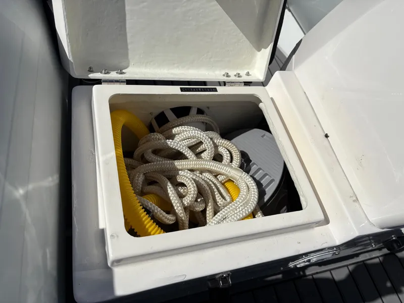 Slide: The Image of Storage compartment on 2023 Highfield Sport 360 boat with ropes and equipment. - 24