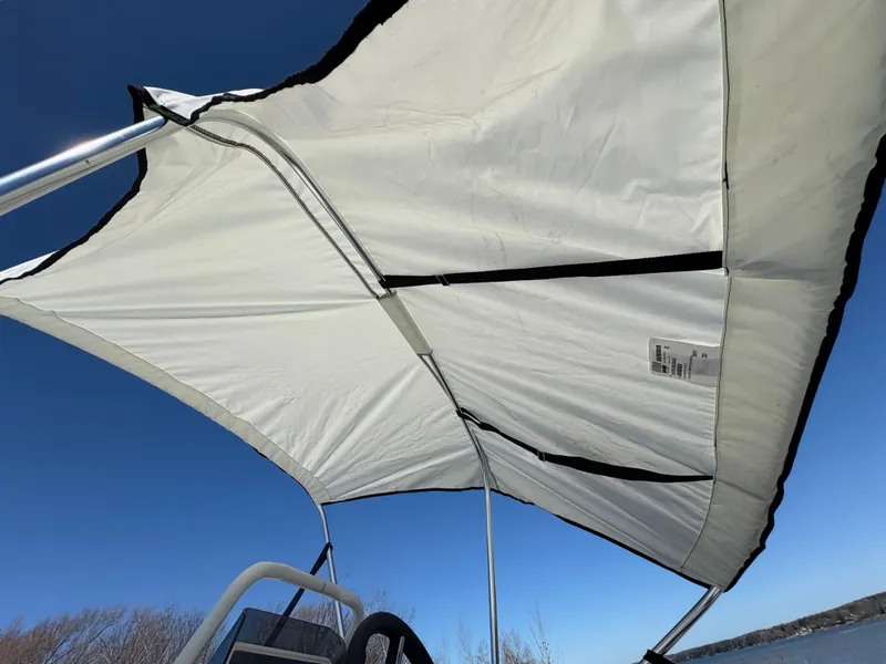 Slide: The Image of 2023 Highfield Sport 360 boat canopy against clear blue sky. - 25