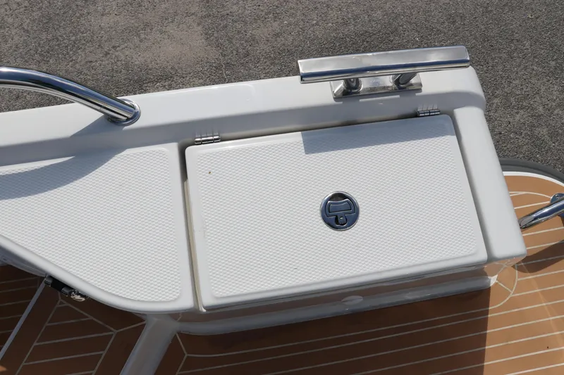 Slide: The Image of Rear deck of 2025 Nimbus Tender 8 boat with storage compartment. - 16