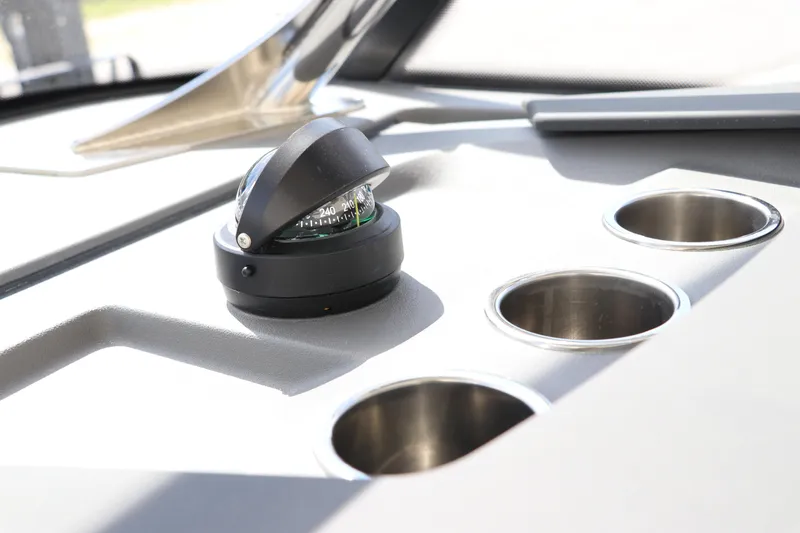 Slide: The Image of Dashboard of 2025 Nimbus Tender 8 with compass and cup holders. - 23