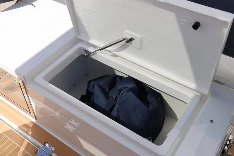 Slide: The Image of Nimbus Tender 8 (2025) boat seating area with storage compartments. - 29