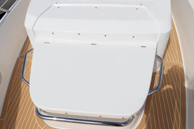 Slide: The Image of 2025 Nimbus Tender 8 boat with sunbed and Mercury engine on open water. - 32