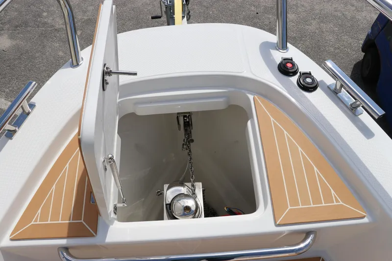 Slide: The Image of 2025 Nimbus Tender 8 boat interior with sleek design and wooden flooring. - 35