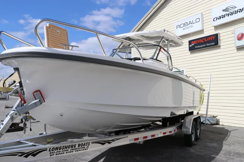 Slide: The Image of 2025 Nimbus Tender 8 boat on trailer at dealership, featuring sleek design and modern build. - 4