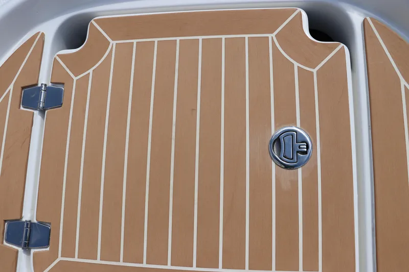 Slide: The Image of Teak deck detail of 2025 Nimbus Tender 8 boat with metal latch. - 40