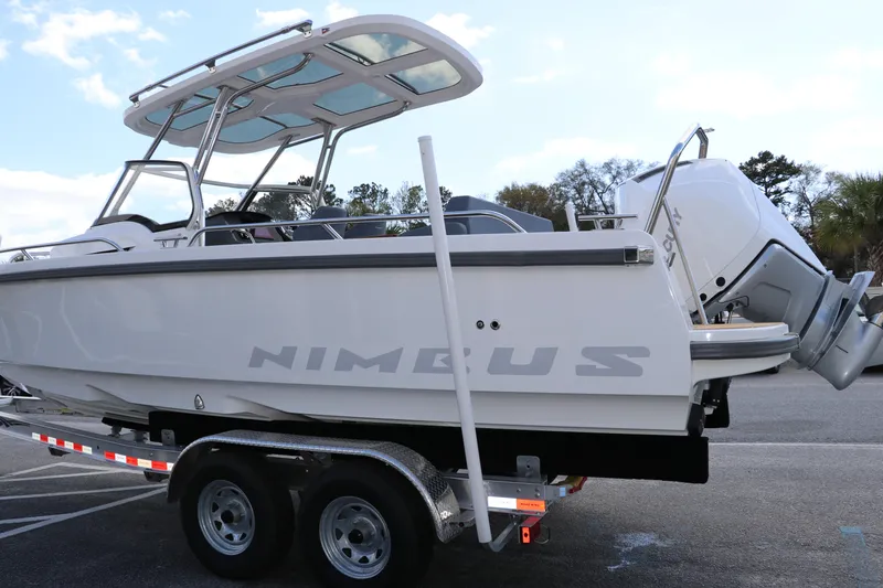 Slide: The Image of 2025 Nimbus Tender 8 boat on trailer, featuring sleek design and modern outboard motor. - 8