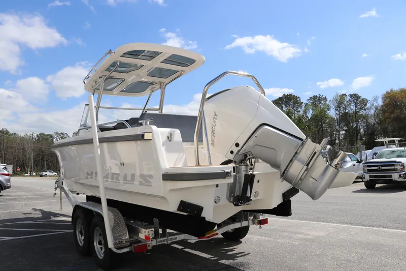 Slide: The Image of 2025 Nimbus Tender 8 boat on trailer, featuring a powerful outboard motor, under a clear blue sky. - 9