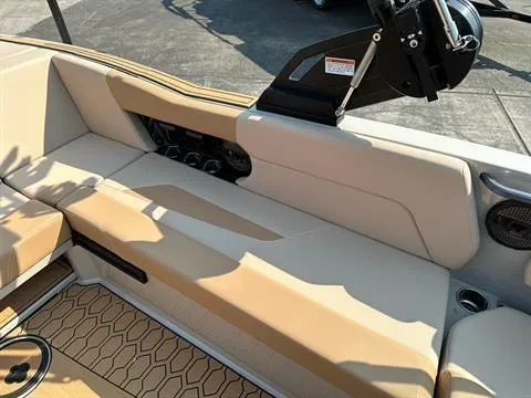 Slide: The Image of 2025 MasterCraft NXT23 boat interior with beige seating and hexagonal patterned flooring. - 6