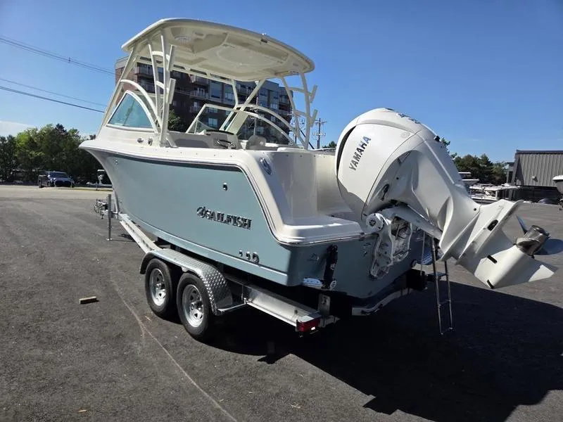 Slide: The Image of 2025 Sailfish 245 DC boat on trailer with Yamaha outboard motor. - 8