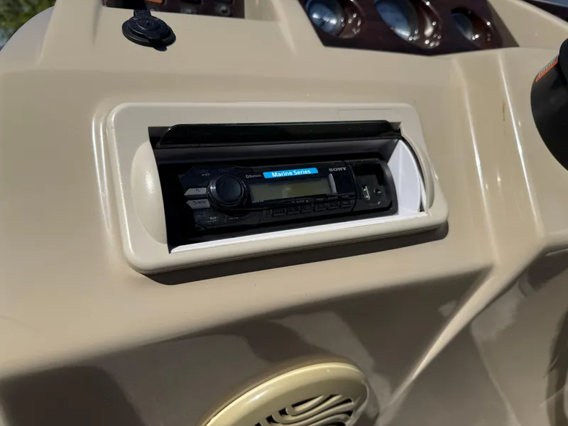 Slide: The Image of 2015 Bennington SLMX boat dashboard with stereo system and speaker. - 11