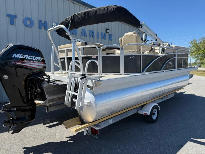 Slide: The Image of 2015 Bennington SLMX pontoon boat on trailer with Mercury outboard motor. - 12