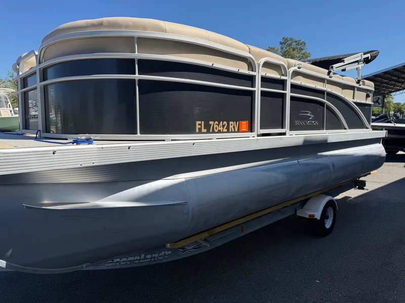 Slide: The Image of 2015 Bennington SLMX pontoon boat on trailer, side view, with Florida registration. - 4