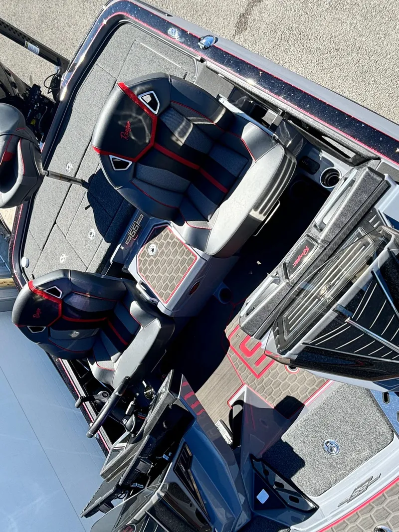 Slide: The Image of 2023 Ranger Z521R boat interior with sleek seating and modern design. - 12
